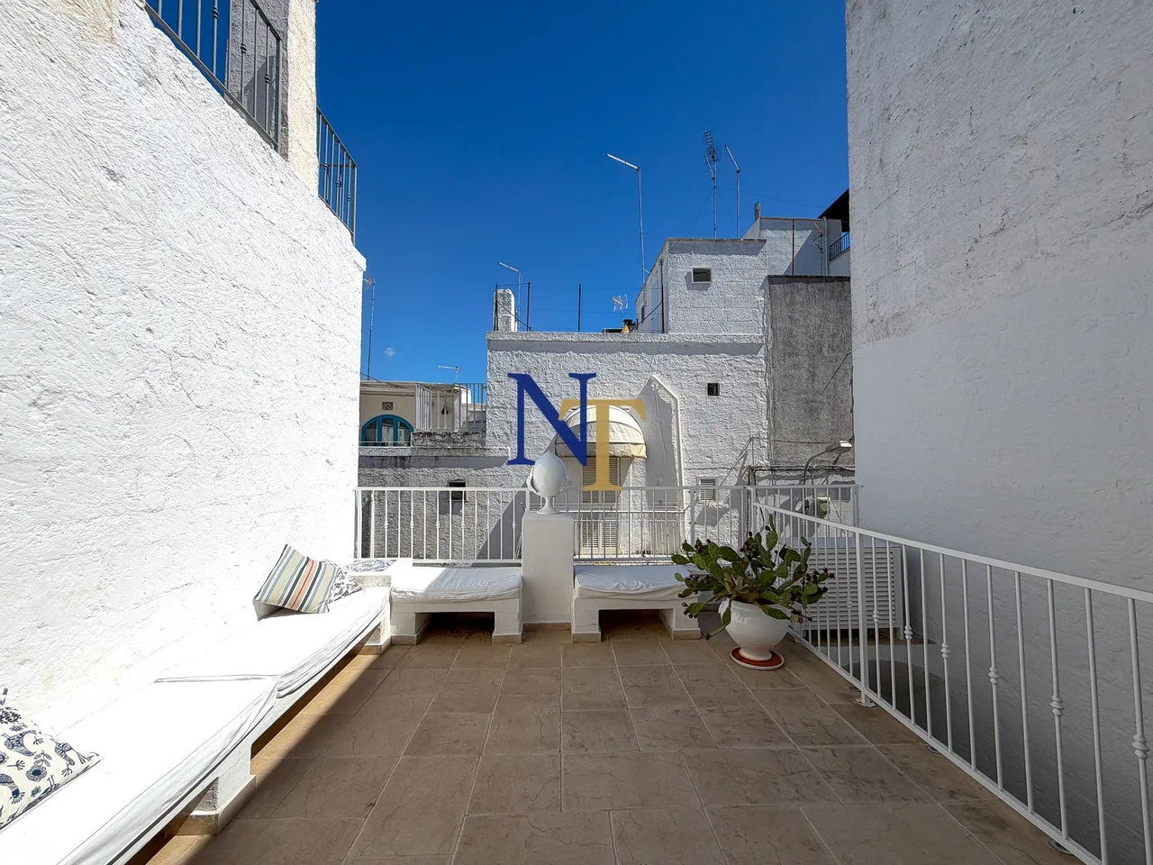 Charming Townhouse with Panoramic Terrace for Sale in Ostuni